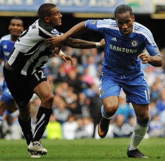 AFP - Chelsea's Ivorian forward Didier Drogba (R) fends off Newcastle United's English defender Danny Simpson (L) during their match