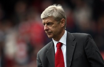 AFP - Wenger walks around the pitch after the game