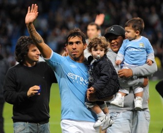 AFP - Carlos Tevez waves to fans during a lap of honour after the English Premier League football match between Manchester City and Stoke City