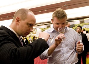 (File photo) Visitors taste Australian wine during the 2010 Australian Wine and Food Show in Ho Chi Minh City
