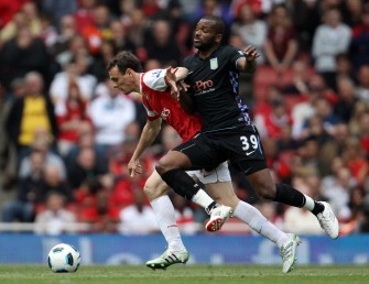 AFP - Arsenal's French player Laurent Koscielny (L) fights for the ball with Aston Villa's Darren Bent during the Premiership football match at the Emirates Stadium in London on May 15, 2011. Aston Villa won 2-1