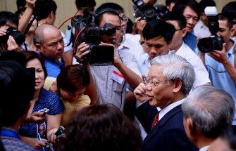 Vietnam Communist Party Secretary General and Chairman of the National Assembly Nguyen Phu Trong talks to media after casting his ballot at a polling station in Hanoi on May 22, 2011.