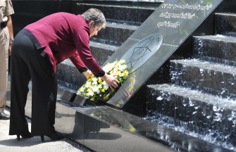 AFP - US Homeland Security secretary Janet Napolitano lays a ceremonial wreath to commemorate the 19 police victims