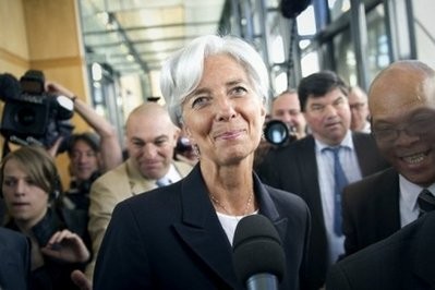 AFP - France's Finance Minister Christine Lagarde (C) arrives upon a press conference to announce her candidacy to head the International Monetary Fund at the ministry in Paris.