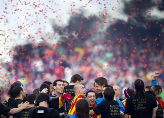 AFP - Barcelona's players celebrate during a ceremony with supporters at the Camp Nou stadium in Barcelona on May 29, 2011 a day after the team won the UEFA Champions League