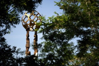 AFP - A sculpture representing men holding a football sits in the garden of the headquarters of football's world governing body FIFA on May 30, 2011 in Zurich.