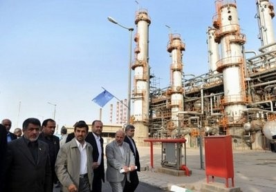 Iranian President Mahmoud Ahmadinejad (centre of group of people) tours the Abadan oil refinery in the southwestern city of Abadan last week