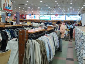 A man browses clothes at a HCMC-based supermarket. Local exporters grapple with the European legislation on chemical evaluation (Photo:Minh Tri)