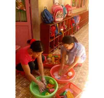 Pre-school teachers at an educational facility in Quang Ngai disinfecting toys to safeguard against HFMD
