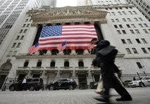 File photo of people walking past the New York Stock Exchange. High-flying shares in Chinese companies