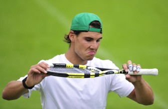 AFP - Nadal returns the ball during a training on the eve of the Wimbledon Tennis Championships