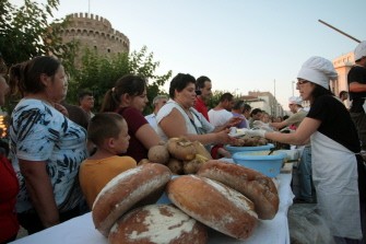 The Greek "ndignant" who protest for fifth week against austerity, give food in front of the White Tower in Thessaloniki on June 22, 2011.