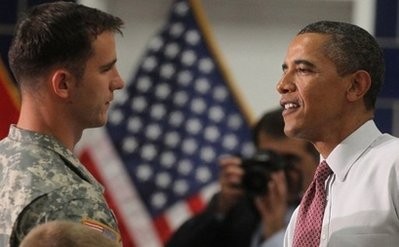 US President Barack Obama's (pictured, C) military commanders, General Favid Petraeus and Admiral Mike Mullen, have said he ignored their advice for a more modest drawdown from Afghanistan