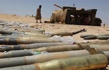 Rebel fighters rest at the frontline in Ajdabiyah June 22, 2011.