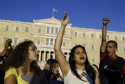 Protesters shout slogans during a rally against a new austerity package in front of the parliament in Athens June 22, 2011