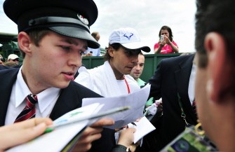 Nadal (C) leaves after a training at the Wimbledon Tennis Championships at the All England Tennis Club, in southwest London on June 30, 2011. AFP