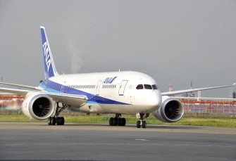 AFP - A Boeing 787 Dreamliner, painted in the ANA colours of white and blue, arrives at Tokyo's Haneda airport during a test flight on July 3, 2011.