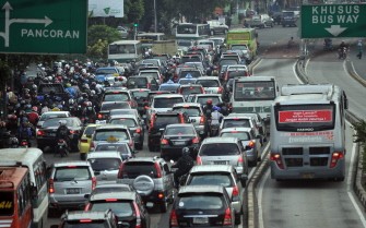 AFP (FILES) This file photo taken on September 22, 2010 shows motorists stuck in the morning gridlock at one of Jakarta's main roads