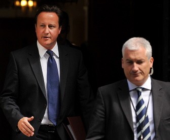 AFP file - British PM David Cameron (L) leaves 10 Downing street in central London on July 6, 2011