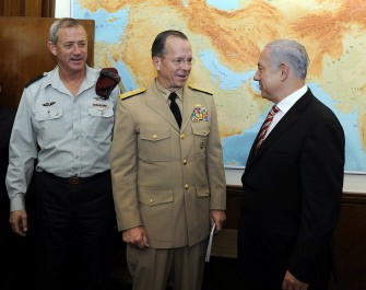 AFP - A handout picture released by the US embassy in Tel Aviv shows Israel's Prime Minister Benyamin Netanyahu (R) shaking hands with Chairman of the Joint Chiefs of Staff of the United States Military, Admiral Michael G. Mullen (C) as Israel's Chief of Staff Lieutenant General Benny Gantz (L) look on in Jerusalem on July 19, 2011
