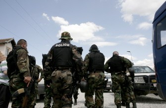 Kosovo police special unit officers secure an area near the divided town of Mitrovica on July 26, 2011.
