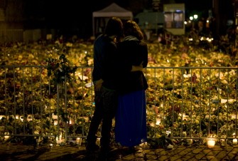 AFP - People visit at a makeshift memorial outside the Cathedral in Oslo on July 28, 2011, in honor of the victims of the July 22 twin attacks in downtown Oslo and on the island of Utoeya.