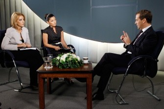 Russian President Dmitry Medvedev (R) gestures during an interview to representatives of TV channels Russia Today on August 5, 2011. Russian President Dmitry Medvedev called the situation in Syria dramatic and expressed enormous concern over the violence in the country