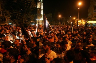 Lebanese protesters march in the northern city of Tripoli late on August 5, 2011 during a rally in solidarity with Syrian anti-government protesters