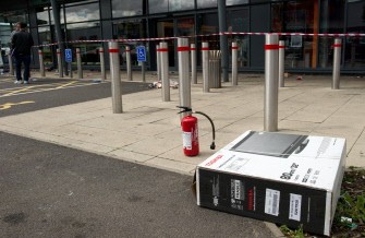 AFP - A pile of damaged goods that were left behind in the carpark of Tottenham Hale Retail Park by looters in Tottenham, north London on the previous night is shown on August 7, 2011.