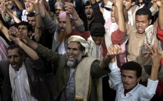 Yemeni anti-government protesters gesture and chant slogans during a rally in Sanaa on August 8, 2011 upon hearing rumors that President Ali Abdullah Saleh will not return to Yemen after leaving a Saudi hospital two months after he was badly wounded in a bomb attack