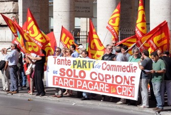 Employers of USB factory protest in front of Chigi palace, in Rome on August 10, 201, as Italian Prime Minister Silvio Berlusconi and his ministers have a meeting with all Italian Union leaders and the Confindustria.