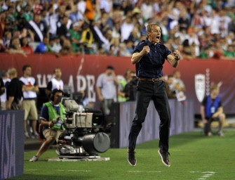 AFP- New US coach Jurgen Klinsmann celebrates after Robbie Rogers of the US scored against Mexico