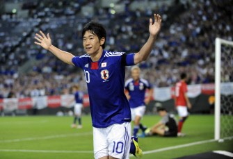 AFP - Japan's forward Shinji Kagawa (C) celebrates his second goal against South Korea