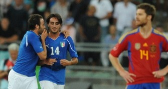 Alberto Aquilani celebrates with his team-mate forward Giampaolo Pazzini after scoring against Spain