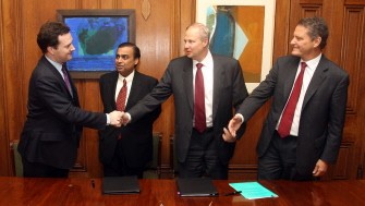 AFP - (FILES) In this photograph taken on February 21, 2011, Britain's finance minister George Osborne (L) shakes hands with BP Chief Executive Bob Dudley (2R) as chairman and managing director of Reliance Industries Mukesh Ambani (2L) and BP Chairman Carl-Henric Svanberg (R) look on during a signing ceremony at 11 Downing Street in central London