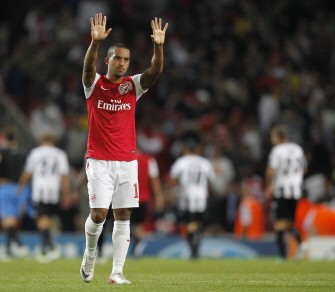 AFP - Arsenal's Theo Walcott acknowledges the crowd at the final whistle