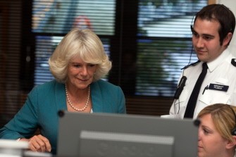 AFP - Prince Charles' wife Camilla visits with her husband (not in pic) the Metropolitian Police Central Communications Command on August 17, 2011