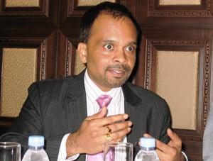 Srinivas Adimulam gestures as he speaks about the Vietnam market during a meeting with media in Ho Chi Minh City August 18, 2011 (Photo: Tuong Thuy)