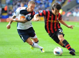 AFP- Manchester City's David Silva (R) vies with Bolton Wanderers' defender Gretar Rafn Steinsson during their English Premier League match