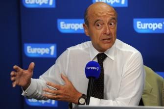 AFP- French Foreign Affairs Minister Alain Juppe speaks on the set of French radio "Europ 1" during a political show focused on Libya situation on August 23, 2011 in Paris