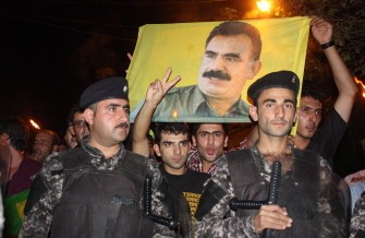Hundreds of Iraqi Kurds, carrying a portrait of jailed Kurdish rebel leader Abdullah Ocalan who is serving a life sentence in Turkey since 1999, protest in the center of the northern city of Sulaimaniyah on August 22, 2011 to denounce Turkey's latest bombing campaign on Kurdish separatist bases in northern Iraq