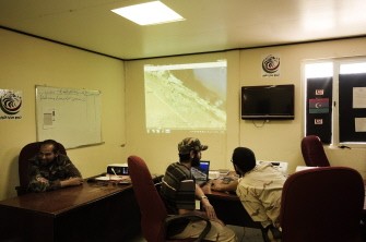 AFP - Libyan rebels look at maps in the operations room at the Zuwaytina petrochemical installation compound used by rebel forces as a central operational node for the eastern front in Zuwaytina, about 150 kms (93 miles) southwest of the opposition capital Benghazi, on August 24, 2011.