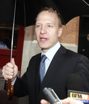 Attorney Shawn Naunton from the office that represents Doninique Strauss-Kahn, former head of the IMF, confirms to reporters waiting by the house that he returned Strauss-Kahn's passport to his client on August 25, 2011 in new York.