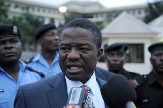 AFP - Nigerian Minister of Police Affairs Caleb Olubolade speaks at the scene of the bomb blast at the United Nations building housing UN agencies in Abuja, on August 26, 2011