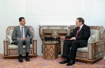 A handout picture from the Syrian Arab News Agency (SANA) shows Russian deputy foreign minister, Mikhail Bogdanov (R), delivering a message to Syrian President Bashar al-Assad from his Russian counterpart Dmitry Medvedev in Damascus on August 29, 2011