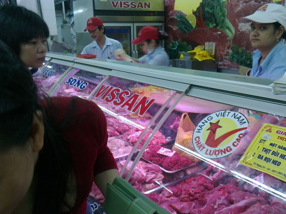 Consumers buying Vissan products in a Co-op Mart ( Photo: B. Uyen)