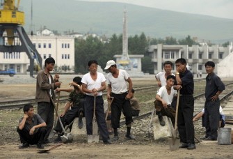 This photo taken on August 30, 2011 shows workers preparing for the start of a ceremony to mark the first-ever cruise to the Mount Kumgang international tourist zone from Rason in North Korea.