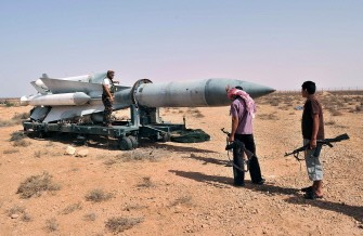 Libyan NTC fighters inspect a Scud missile at Al-Burkan base (codenamed K9), 70 kms from Bani Walid, southeast of Tripoli, on September 2, 2011.