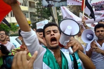 Members of the Syrian community in Bucharest protest against Syrian President Bashar al-Assad, on September 2, 2011, in Bucharest, Romania.