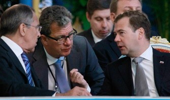 Russian President Dmitry Medvedev (R) speaks with Foreign Minister Sergey Lavrov (L) and Medvedev's foreign policy aide Sergei Prikhodko (C) during a meeting of the Commonwealth of Independent States (CIS) leaders in the Tajik capital Dushanbe, on September 3, 2011